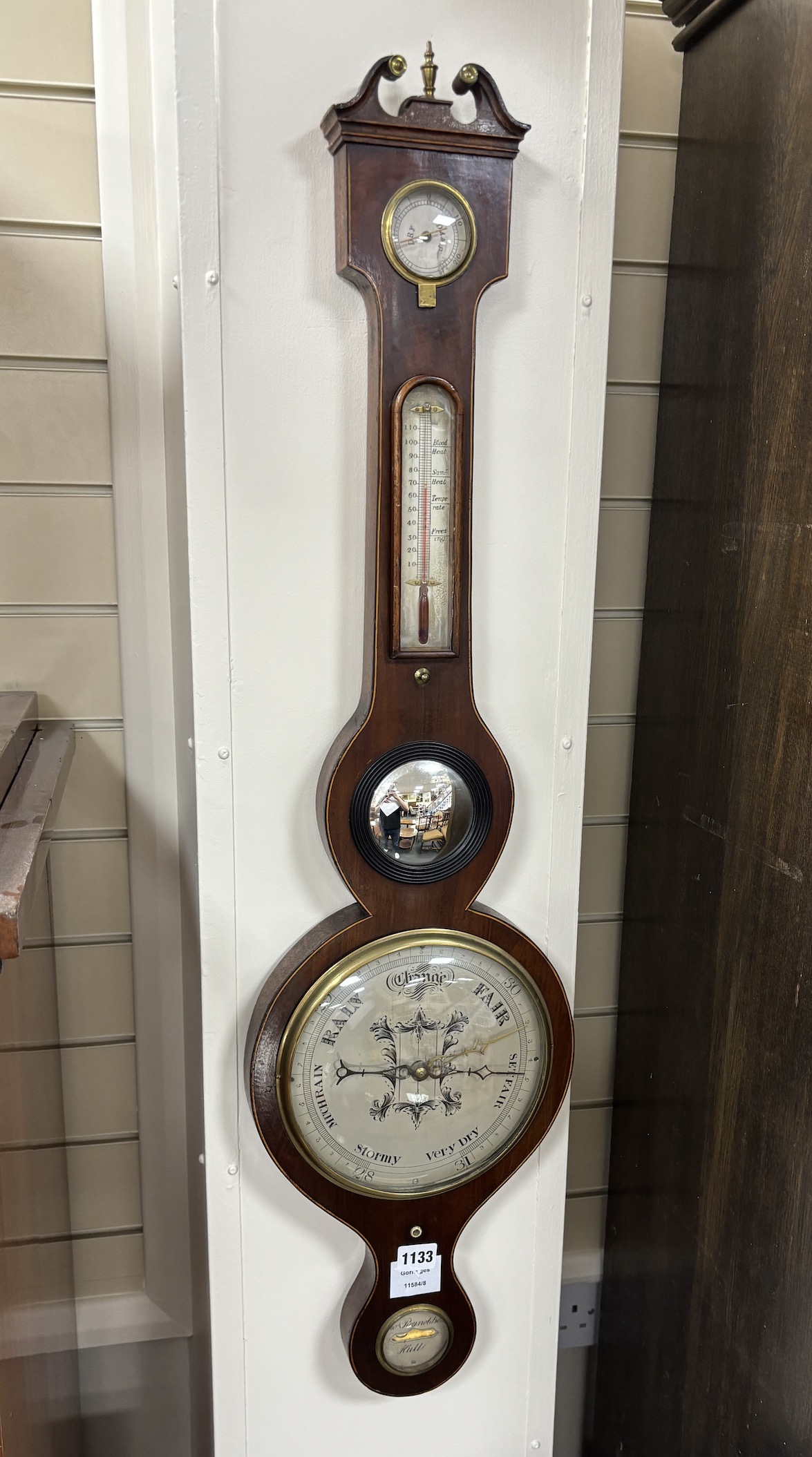 An early 19th century mahogany wheel barometer by Reynoldson of Hull, height 96cm